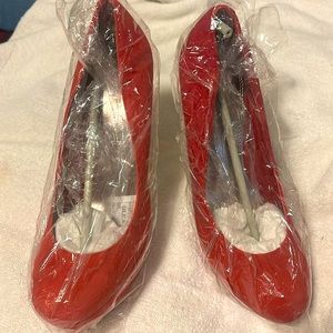 Red pair of pumps very nice and high heals.